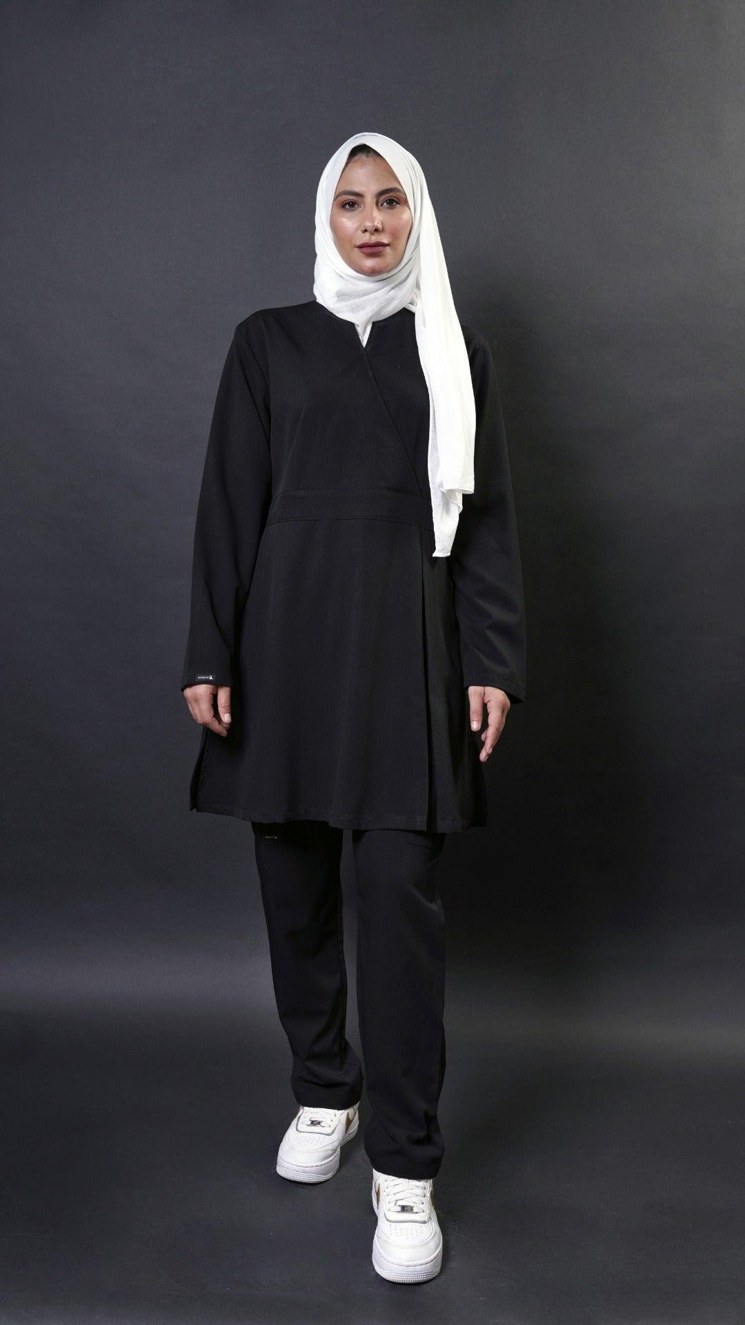   Extra long scrub top with long sleeves in black perfect for women in healthcare! This top has a 36 inch length and flare top design for a modest look. It's also hijabi friendly, so you can feel comfortable and cover the lower bottom.