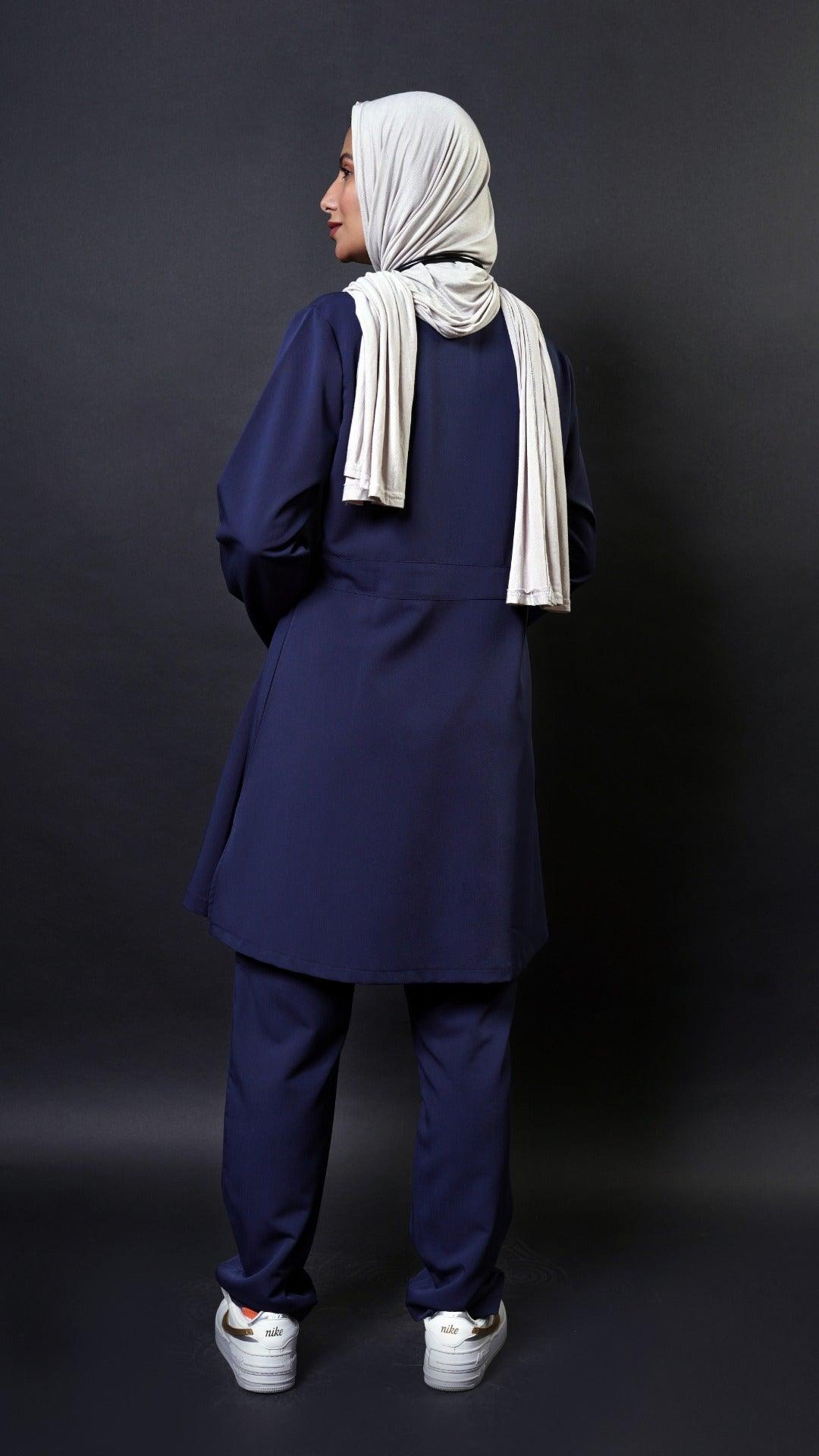  Extra long scrub top with long sleeves in navy blue perfect for women in healthcare! This top has a 36 inch length and flare top design for a modest look. It's also hijabi friendly, so you can feel comfortable and cover the lower bottom.