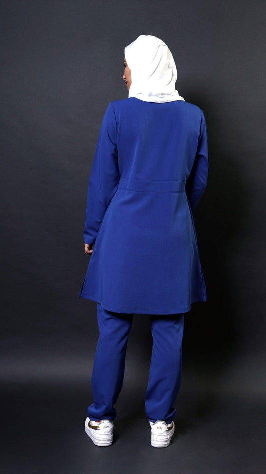 Extra long scrub top with long sleeves in royal blue perfect for women in healthcare! This top has a 36 inch length and flare top design for a modest look. It's also hijabi friendly, so you can feel comfortable and cover the lower bottom.